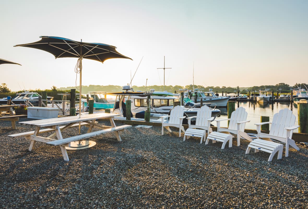 4 white chairs and a white picnic table
