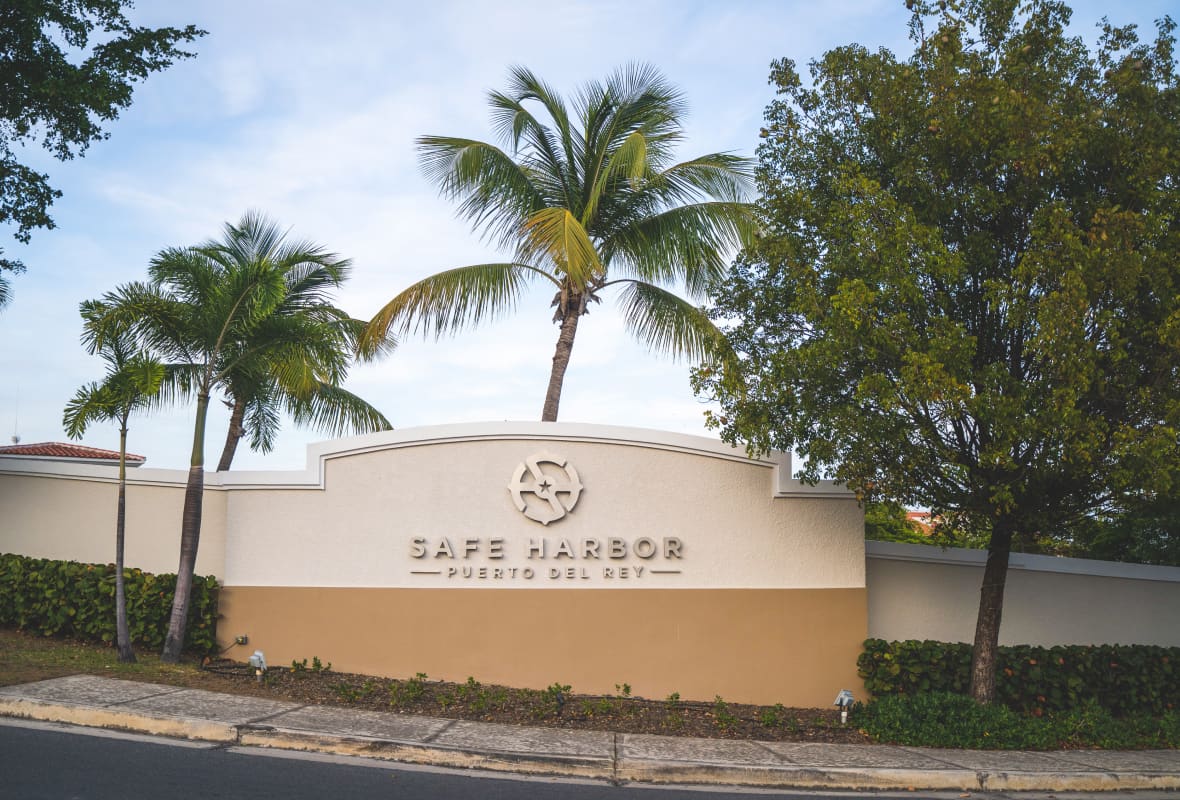 safe harbor puerto del rey entrance with logo