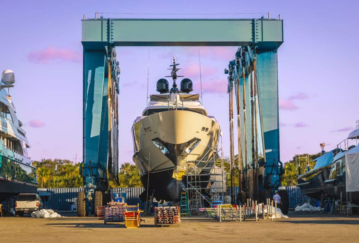 yacht going through maintenance on a dry dock