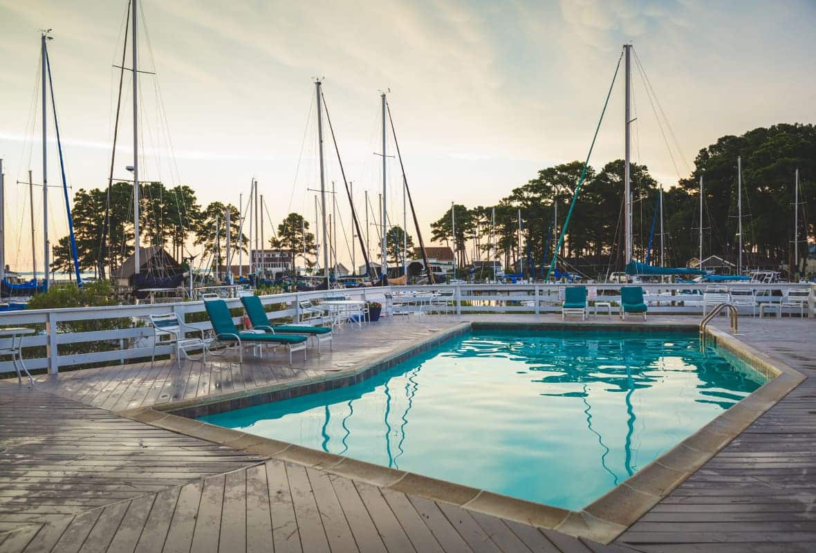 green chairs around a pool