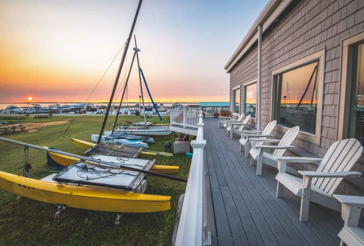 chairs on a porch during sunset