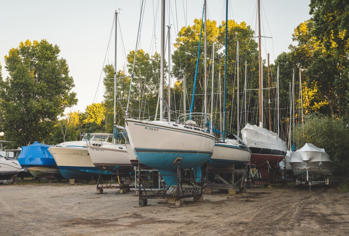 boats sitting on racks outside