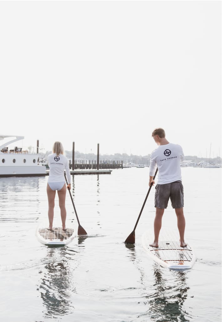 two people paddleboarding