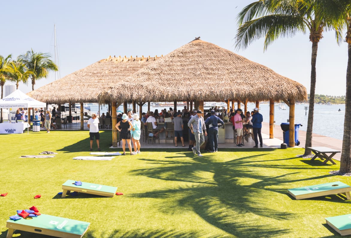 outdoor covered space with many people having a party