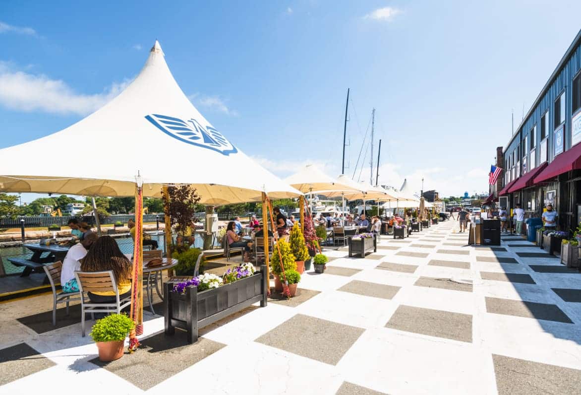 white tents with tables and chairs underneath them