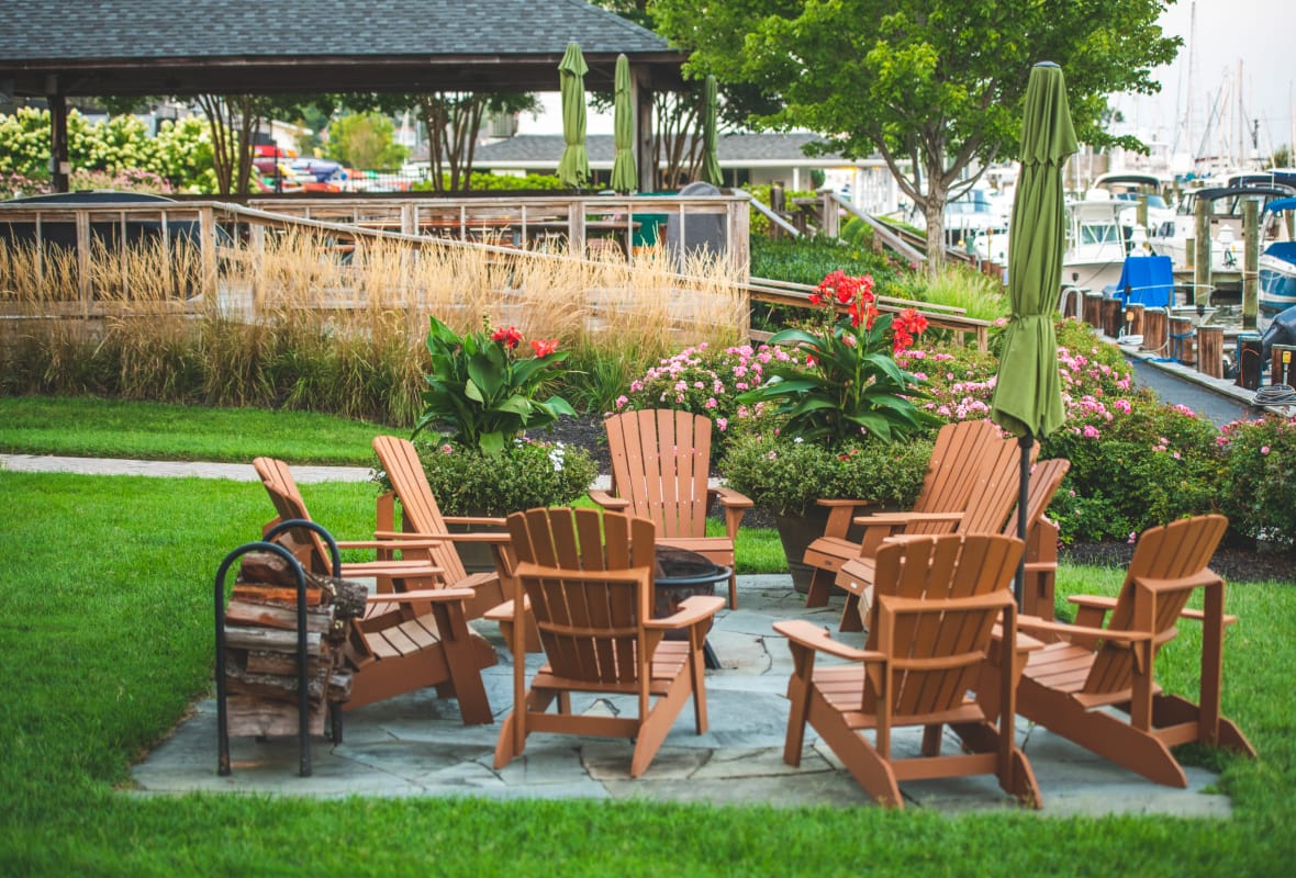 brown chairs around a fire pit