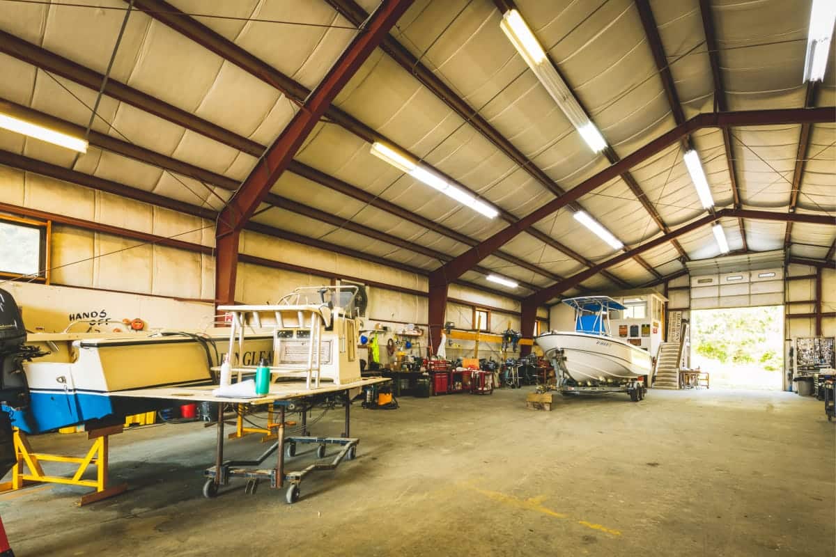 warehouse with a couple boats