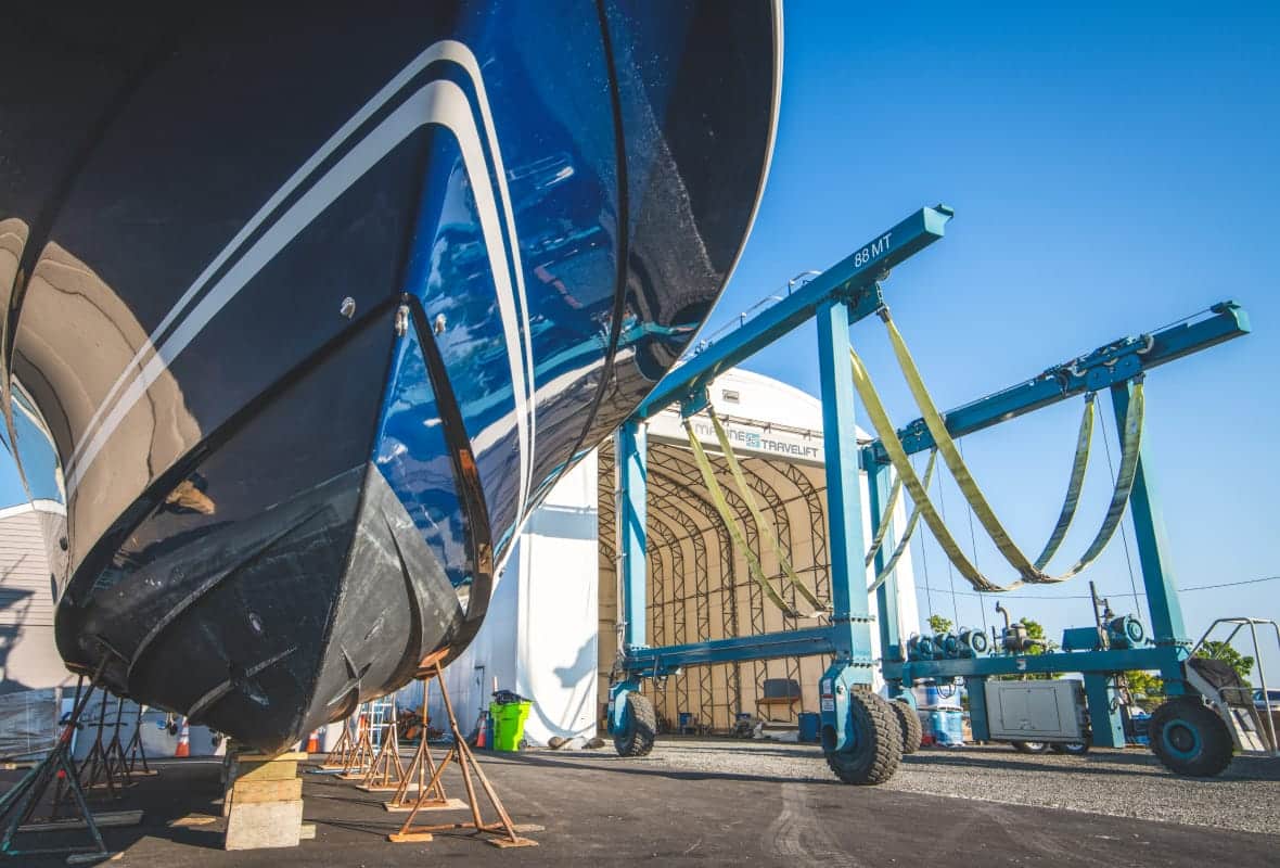 underside of boat next to a marine travelift
