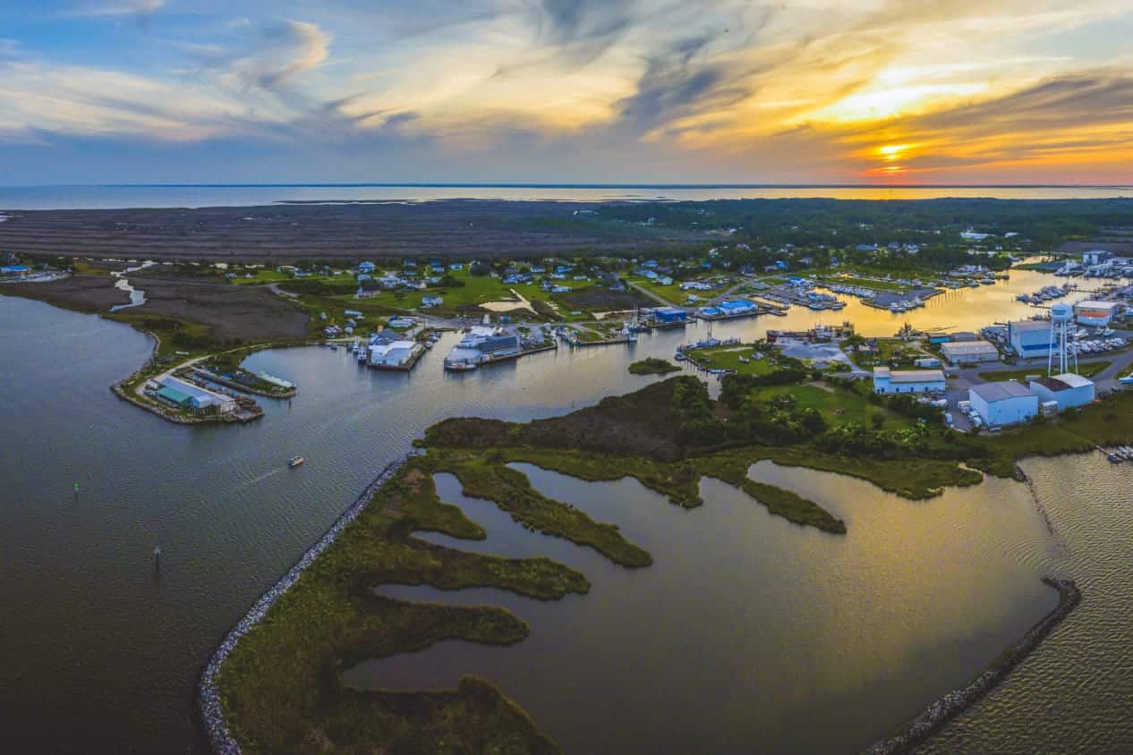Cove lined with little buildings at sunset