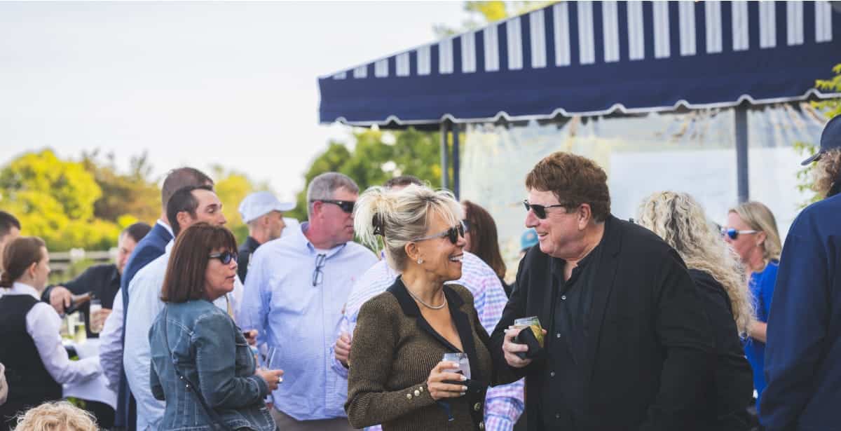 two people having a conversation at an event