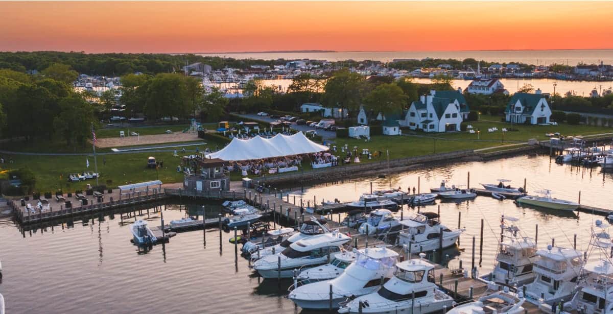 montauk yacht club with a sunset behind it