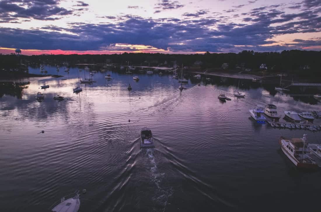 boats on water at sunset