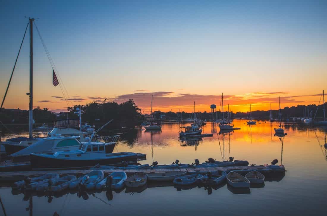 boats in a marina at sunset