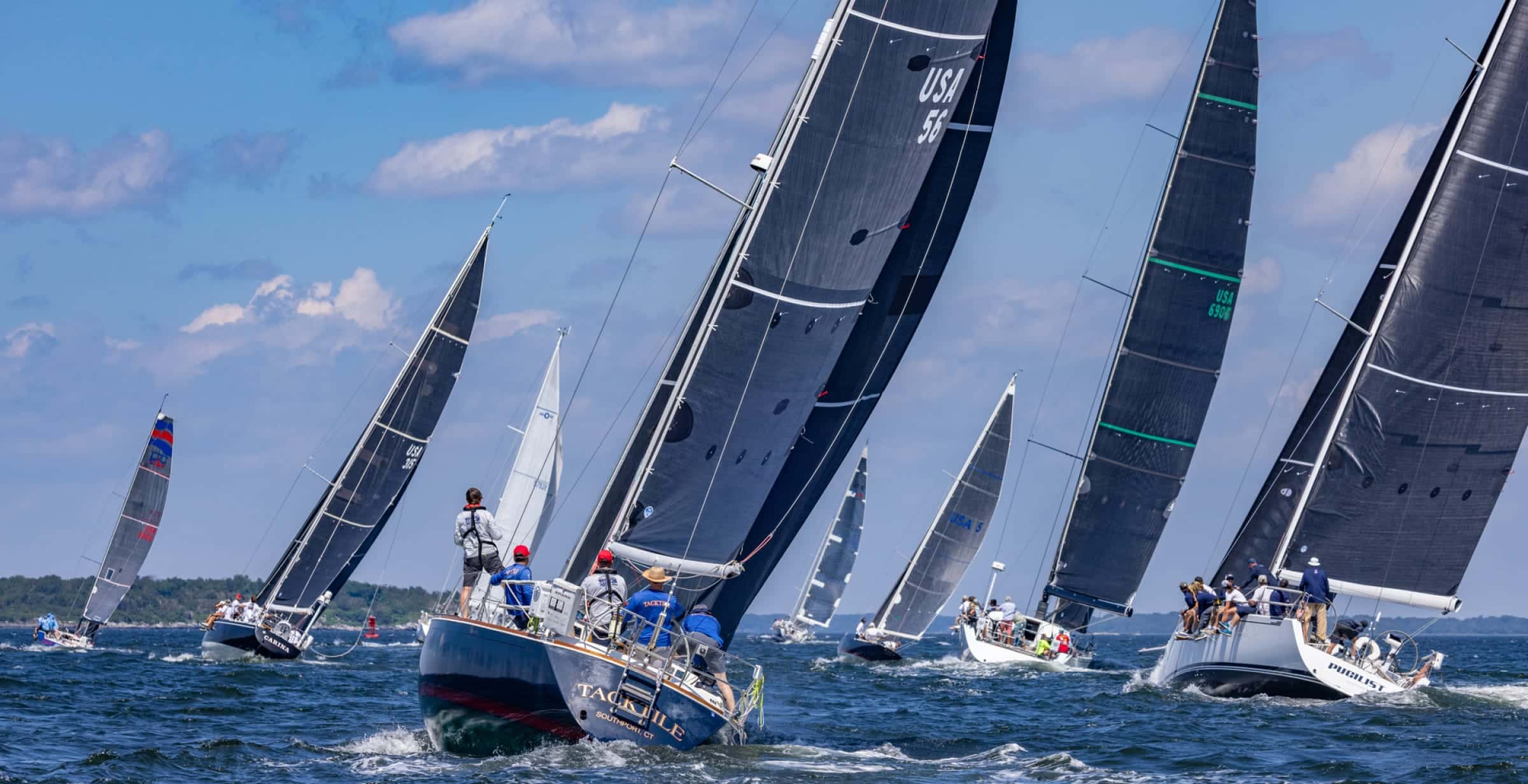 many sailboats in the water