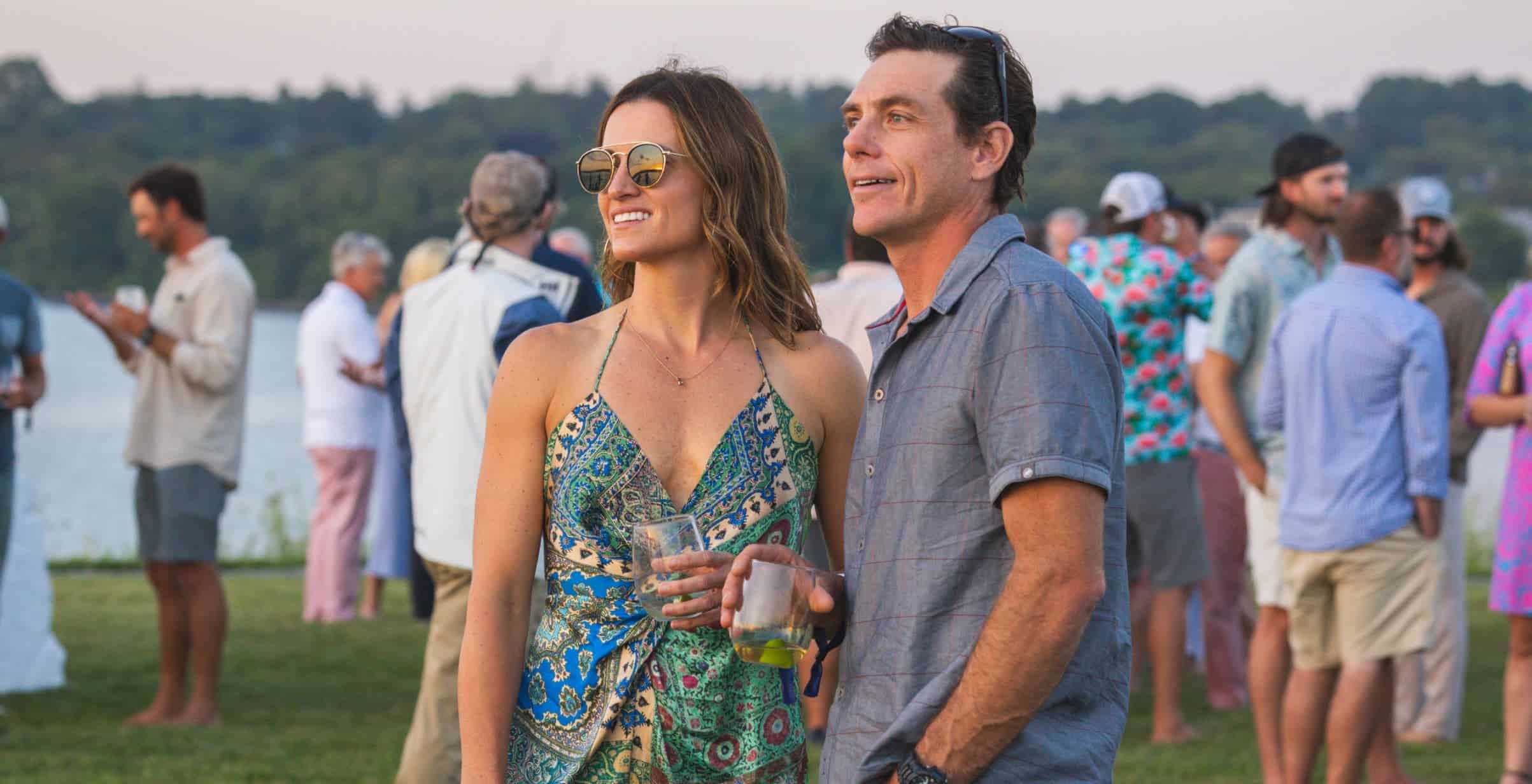 Couple in a crowd look into the distance