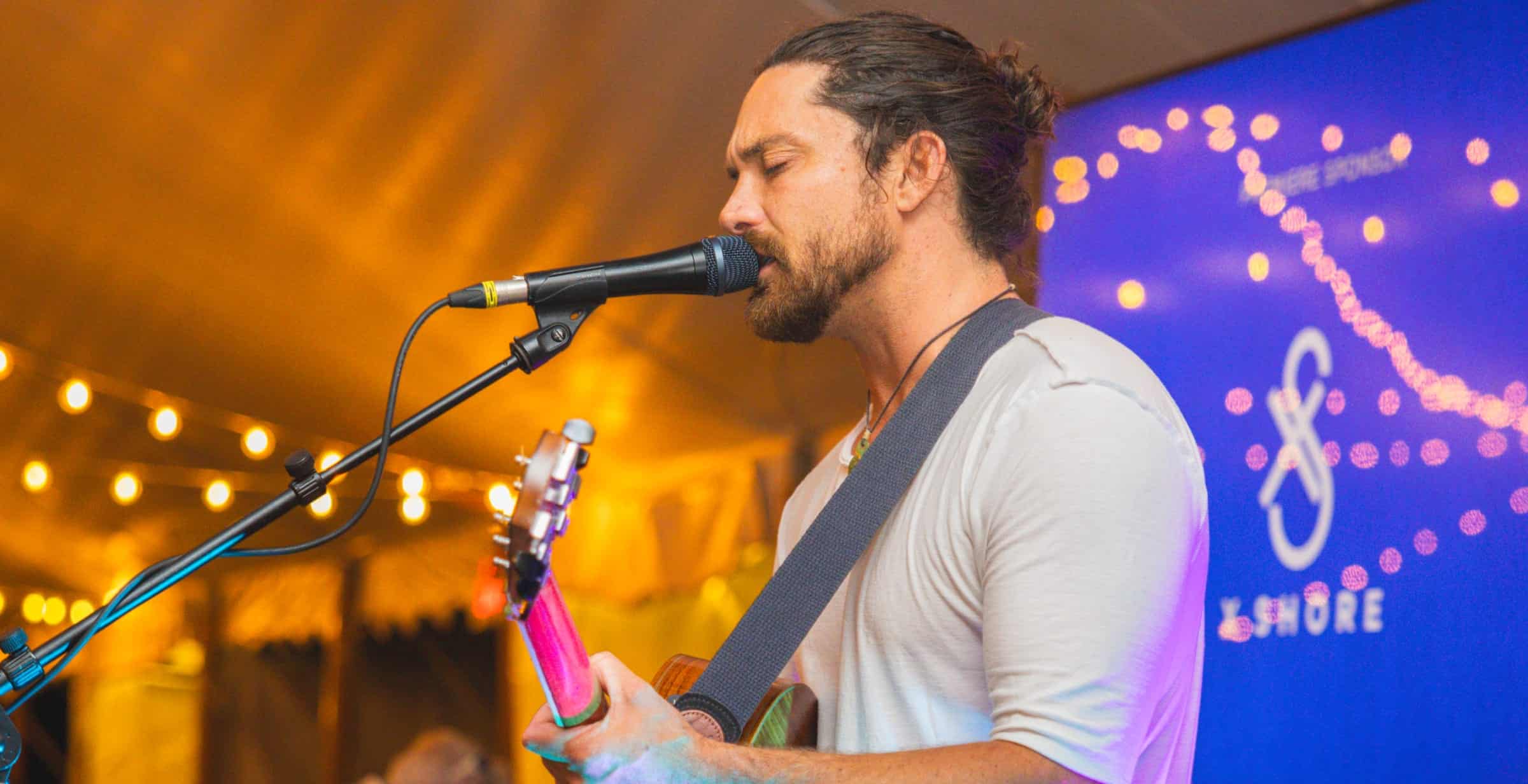 man singing into microphone