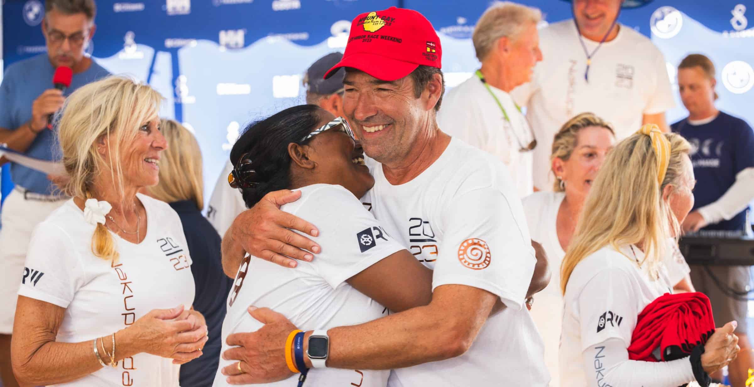 two people hugging and smiling